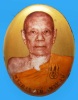 ล็อกเก็ตรุ่นแรกเล็ก ฉากทอง ฝังเม็ดแตงหงษ์เงิน ตะกรุดเงิน ๑ ดอก หลวงปู่พิชัย ฐิติลาโภ หมายเลข 66 