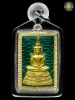 เหรียญพระแก้วมรกต เนื้อเงินลงยาสีเขียวบุหน้าทองคำ หมายเลข ๒๓ (เลี่ยมใส่เกศา)